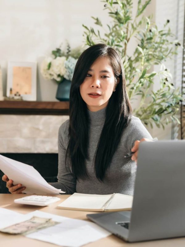 close-up-hand-of-business-woman-using-laptop-while-plan-and-discussion-information-for-financial-.jpg